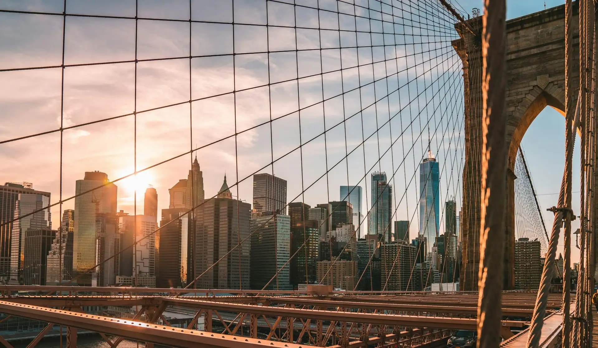 The Brooklyn Bridge cables framing the Manhattan skyline
