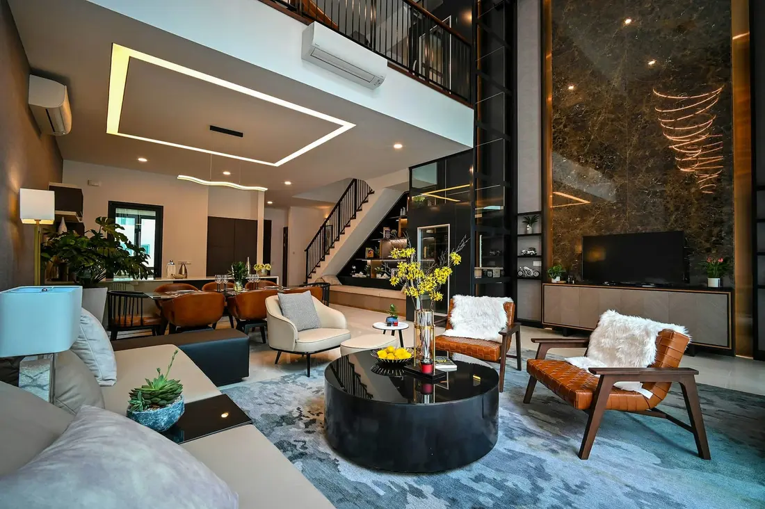 A double-height hotel lobby with modern finishes